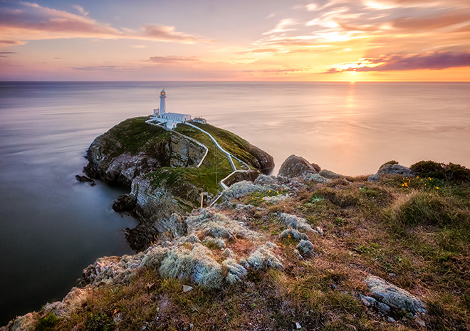 South Stack Lighthouse at sunset, Holy Island, Wales.