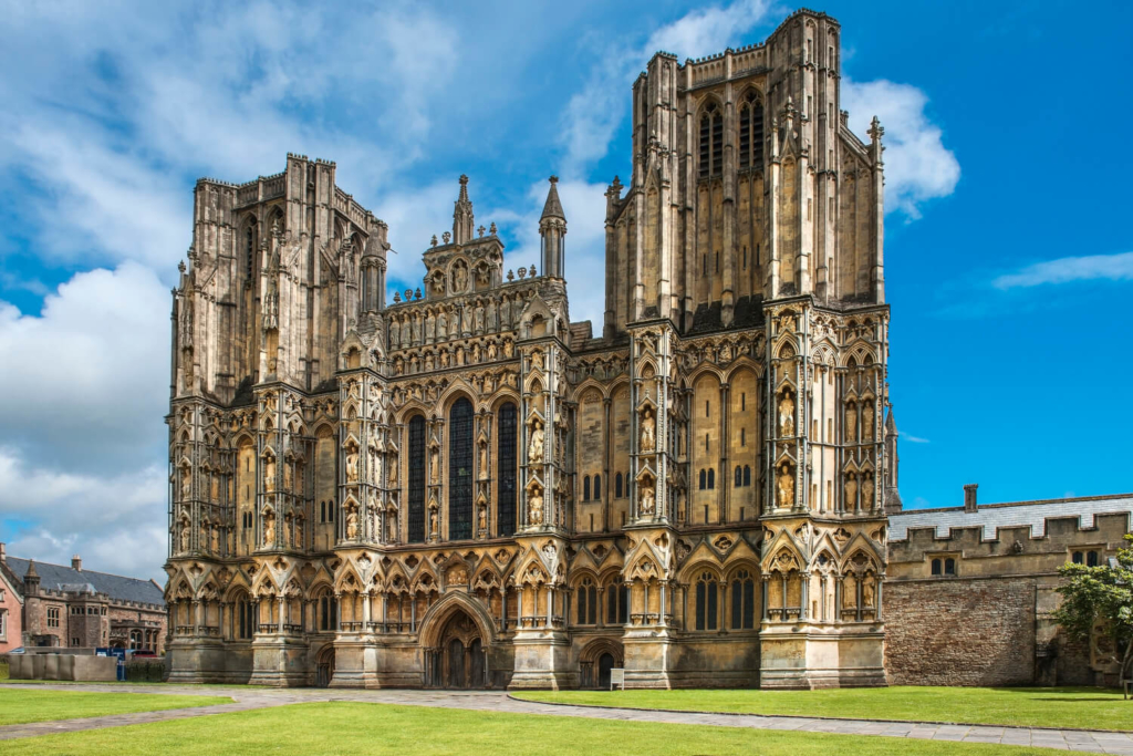 Appreciate the ornate facade of the beautiful Wells Cathedral, Somerset, on one of our England travel packages.