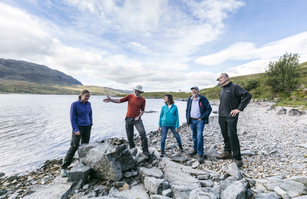 Tour group on the Assynt coast, Highlands, Scotland.