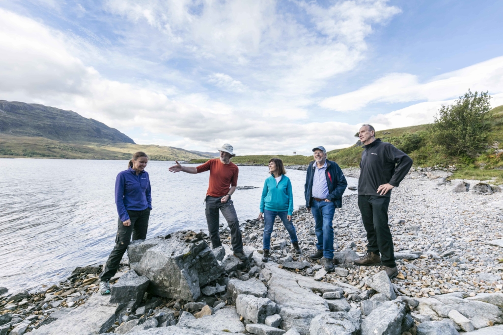 Tour group on the Assynt coast, Highlands, Scotland. Small group tours for solo travellers.